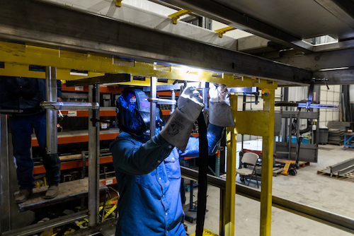 P-Tech welding Elgin High School seniors photographed during their internship at Athena Manufacturing Tuesday, March 8, 2022.